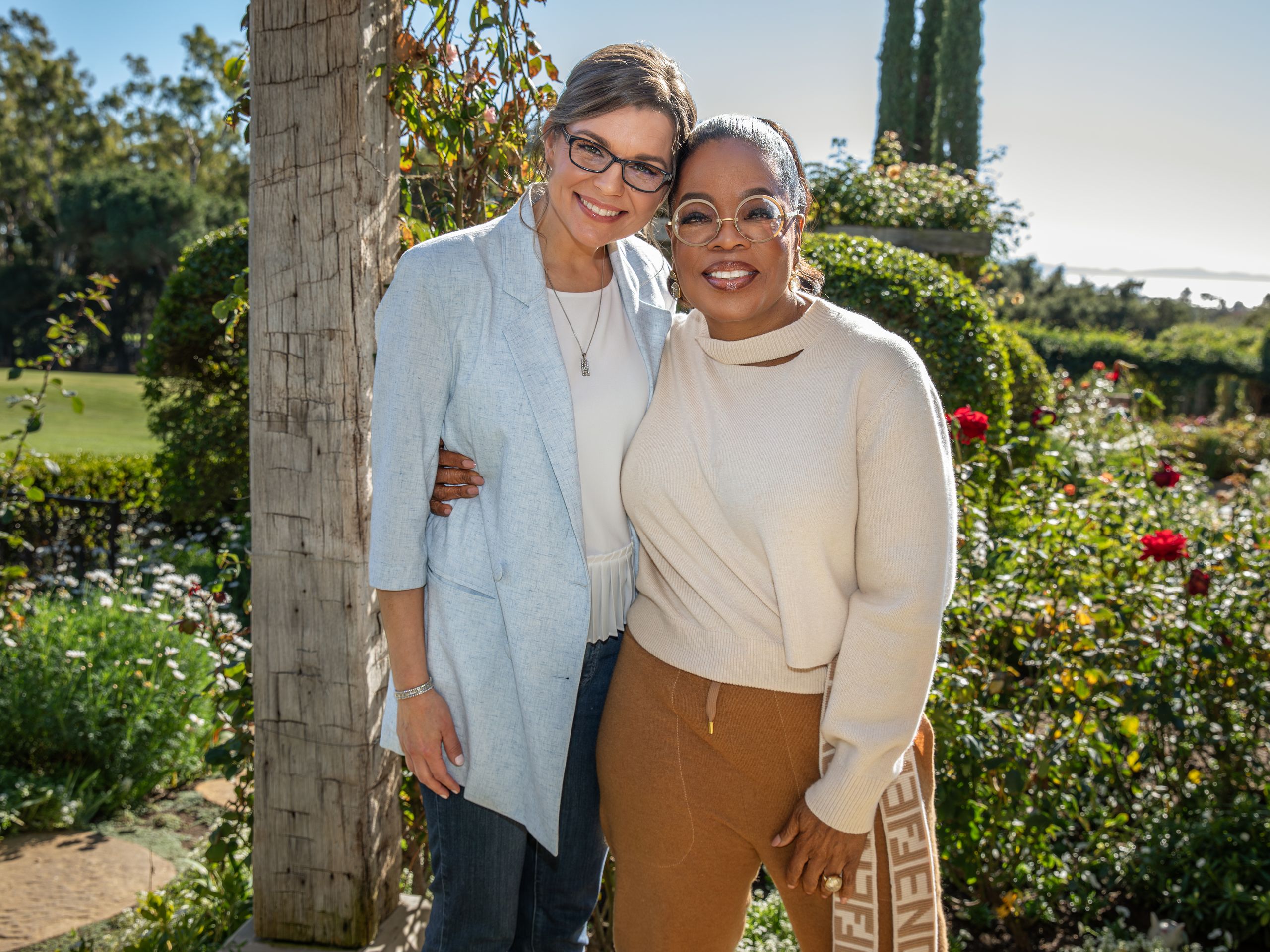 Image may contain Oprah Winfrey Blazer Clothing Coat Jacket Pants Blouse Accessories Glasses Face Head and Person