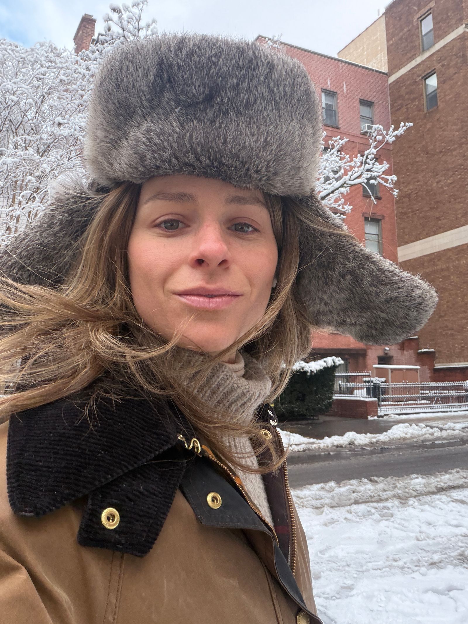Image may contain Face Head Person Photography Portrait Clothing Hat Coat Cap Jacket and Scarf